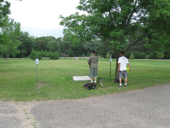 Two men playinf disc golf