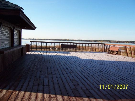 Image of woden deck and lake in background