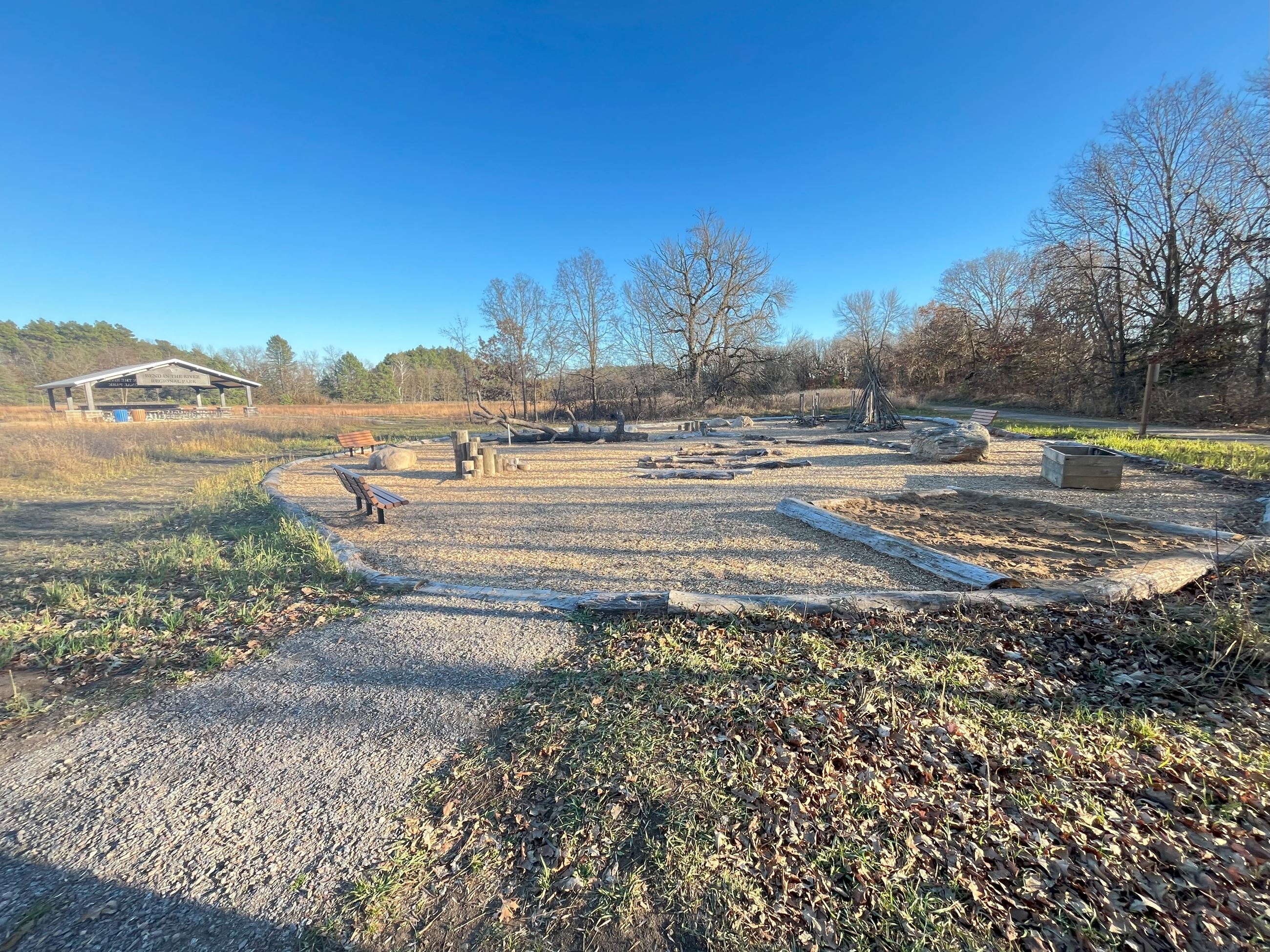 Natural Play Area Consisting of a Sandbox and Play Equipment Made From Logs (JPG)